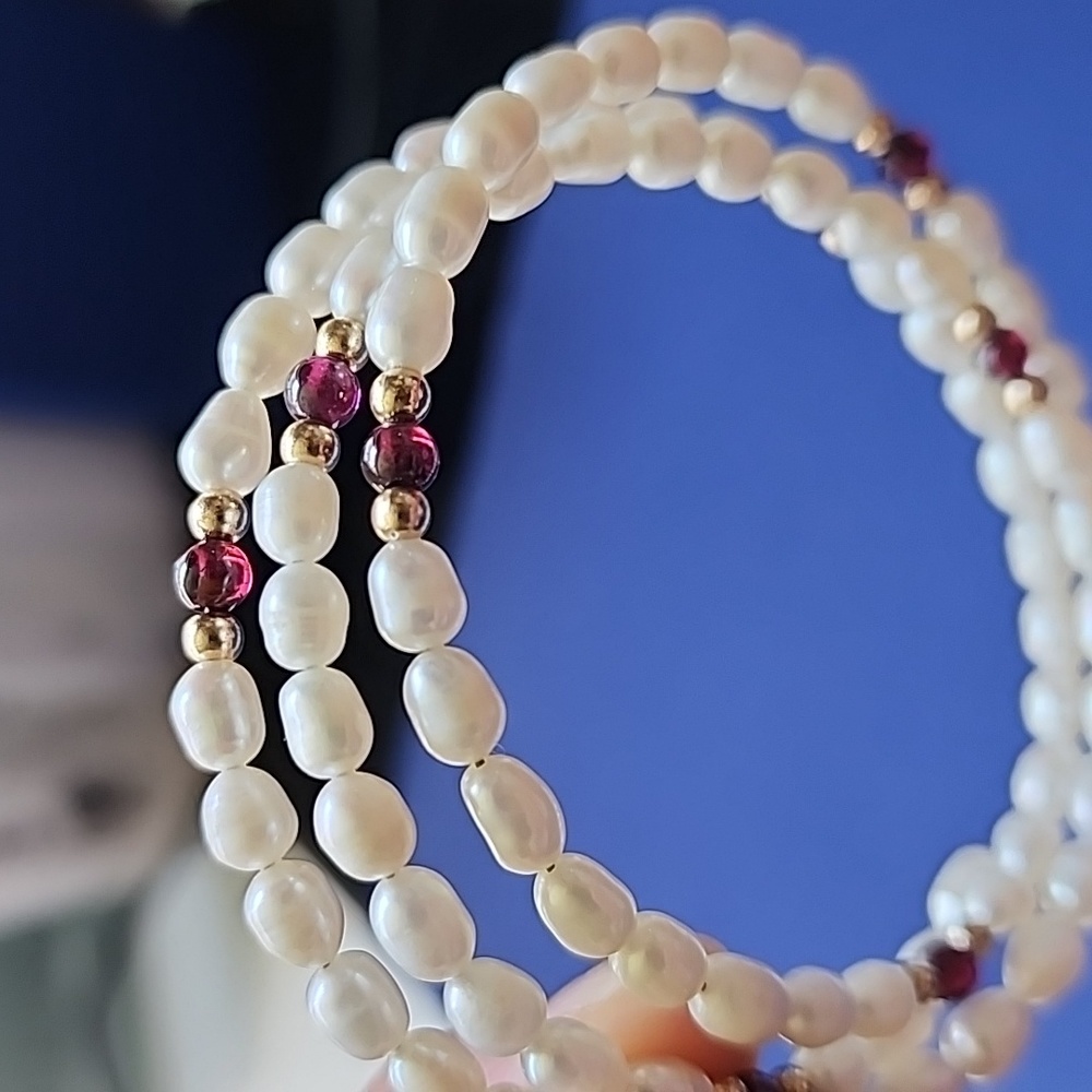 Freshwater pearls, gold beads, and semiprecious stone.